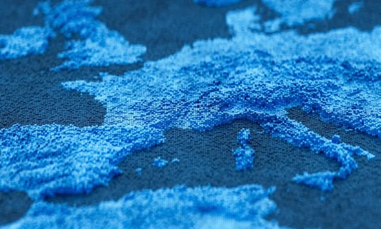 Abstract pixelated map of Europe in shades of blue.