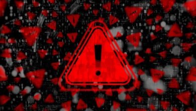 Red warning sign with exclamation point against binary code background.