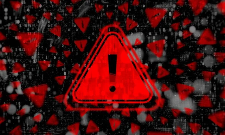 Red warning sign with exclamation point against binary code background.