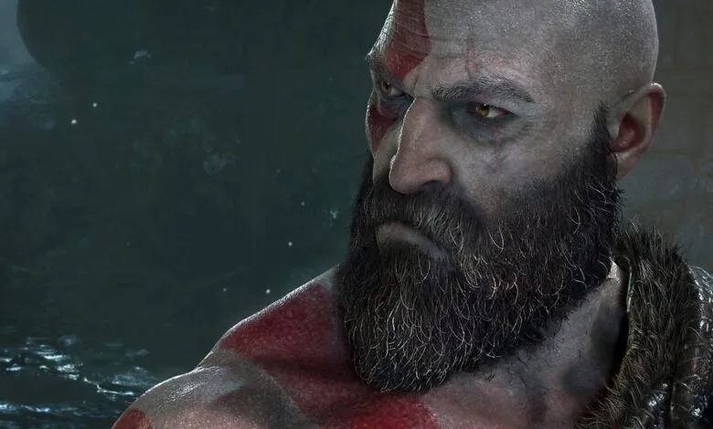 Close-up of Kratos from God of War, showing his intense gaze and beard.