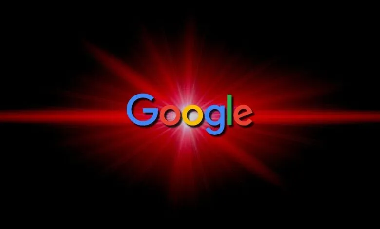 Google logo with a red lens flare effect on a black background.