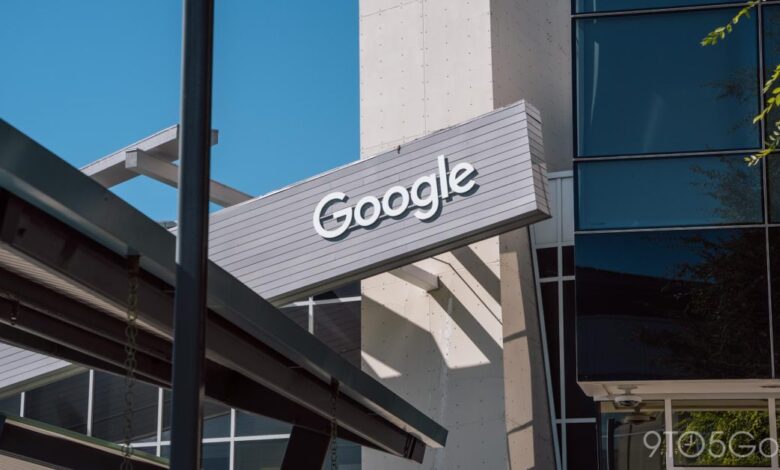 Google logo sign on the exterior of a modern office building.