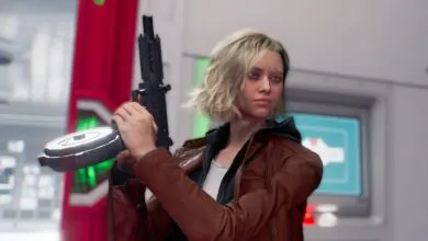 Grace Ashcroft holds a weapon with a determined expression.