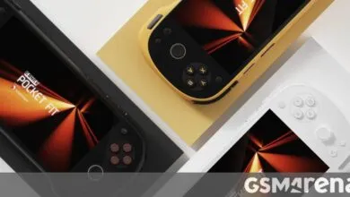 Three Konker Pocket Fit handheld gaming devices in black, yellow, and white.