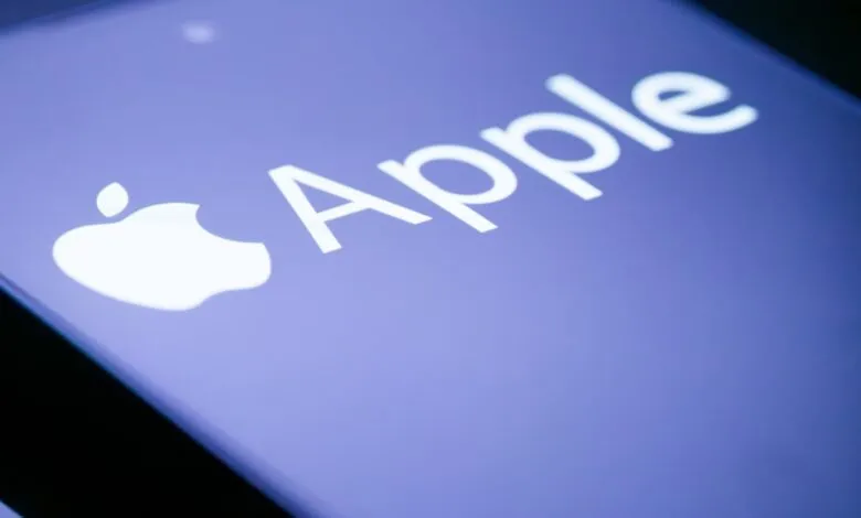 Close-up of Apple logo and wordmark on a purple background.