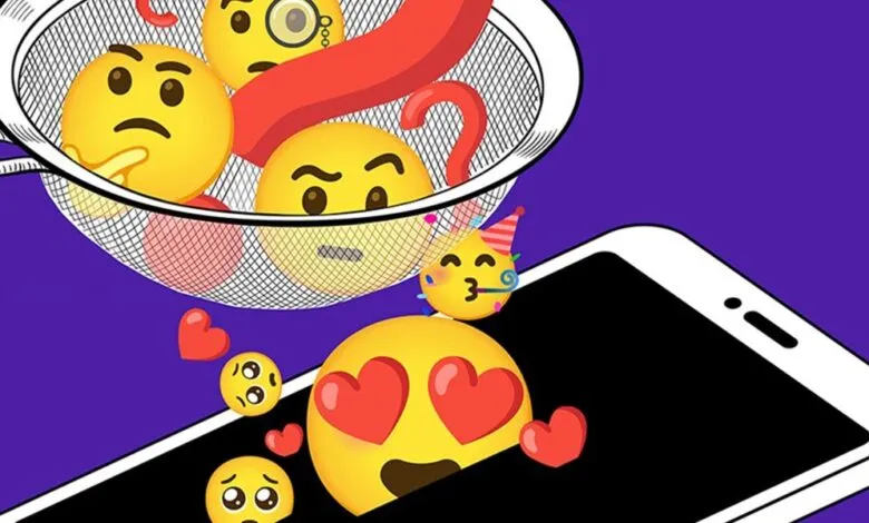 Emojis in a strainer above a phone screen, conveying digital emotions.