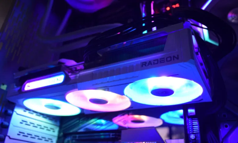 Close-up of a Radeon graphics card with RGB lighting inside a computer case.