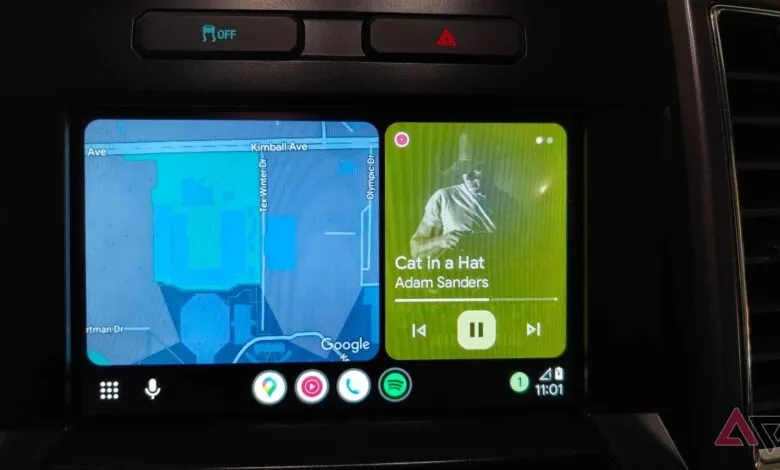 Car dashboard screen showing Google Maps and music player with 'Cat in a Hat' by Adam Sanders.