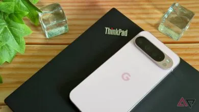 ThinkPad laptop with a Google Pixel phone on top, next to decorative ice cubes.