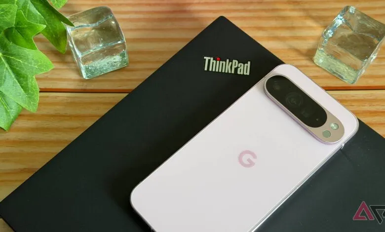 ThinkPad laptop with a Google Pixel phone on top, next to decorative ice cubes.