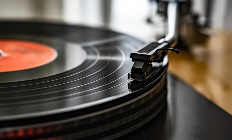 Close-up of a vinyl record player with a black record spinning.