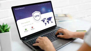 Laptop displaying VPN connection with hands typing on keyboard.