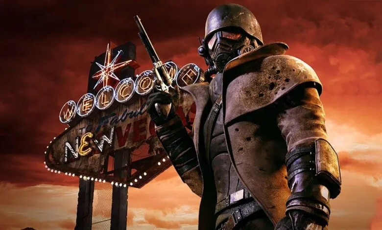 Character in helmet and gas mask holds gun in front of Vegas sign.