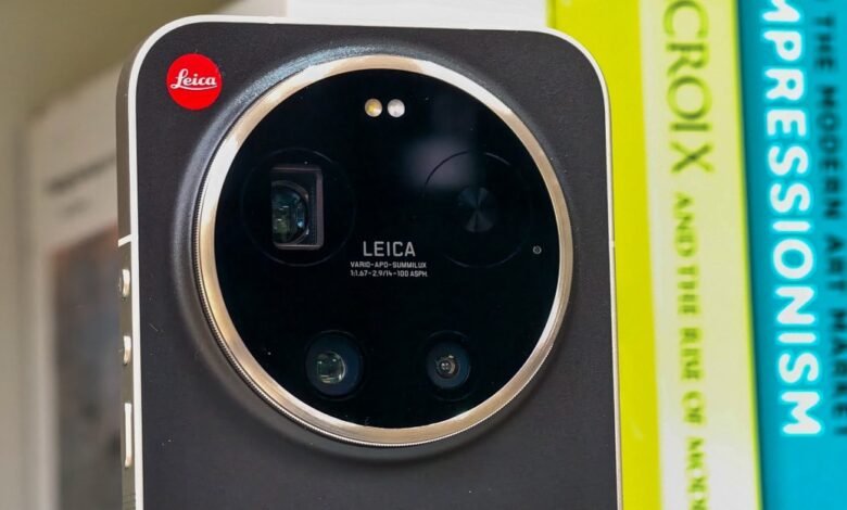 Close-up of Leica phone camera with multiple lenses and Leica logo.