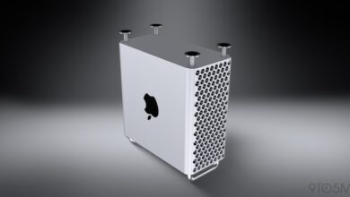 Silver Mac Pro computer tower with circular hole design.