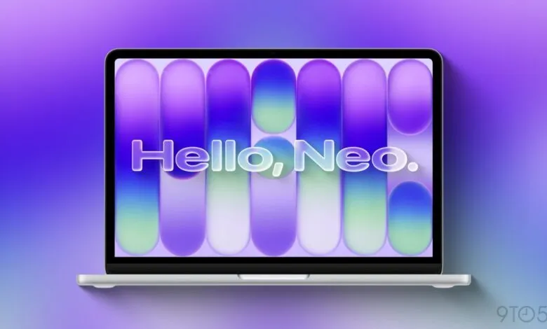Silver laptop displays 'Hello, Neo' on a purple and blue gradient background.