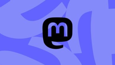 Mastodon logo, a stylized elephant trunk, in black on a blue background.