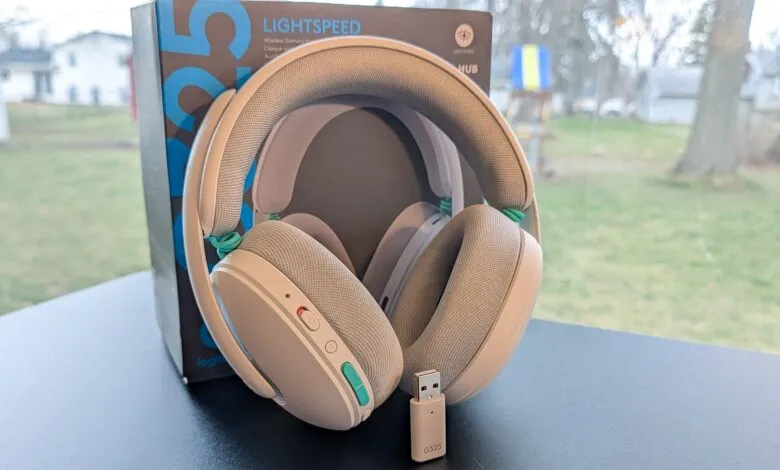 Logitech G735 wireless gaming headset with USB dongle and box.