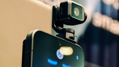 Smartphone with attached external camera for enhanced photography.