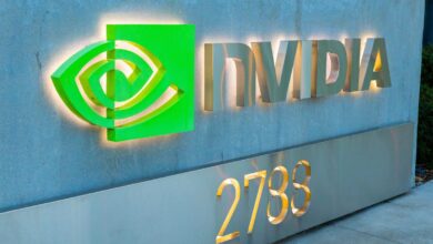 NVIDIA logo and building number, green eye symbol and silver letters.