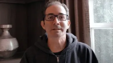 Jeff Kaplan, former Blizzard director, wearing glasses and a hoodie.