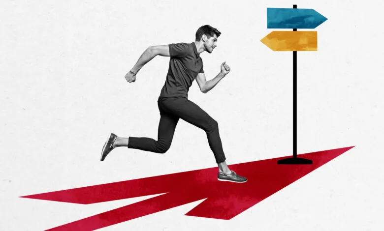 Man running on red arrow towards blue and yellow directional signs.