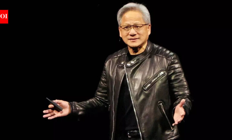 Jensen Huang, Nvidia CEO, in leather jacket against black backdrop.