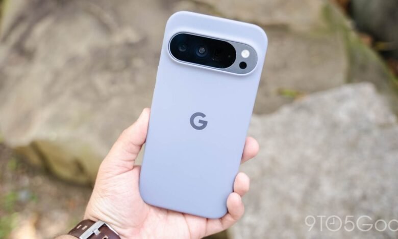 Hand holding a Google Pixel phone in a light purple protective case.