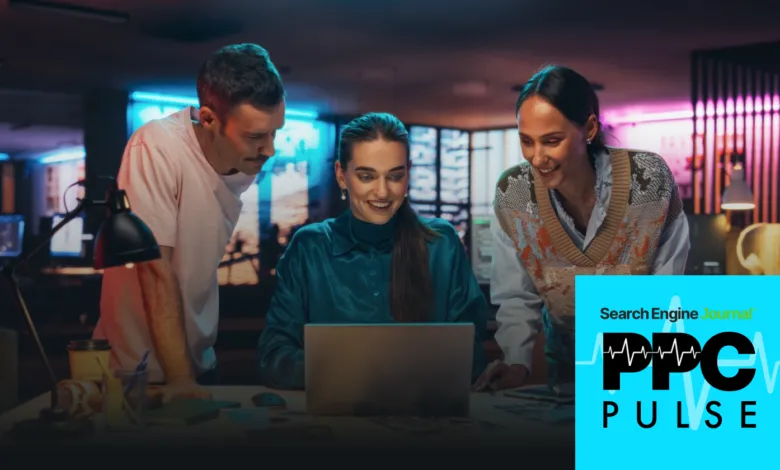 Three colleagues collaborate on a laptop in a modern, colorful office.