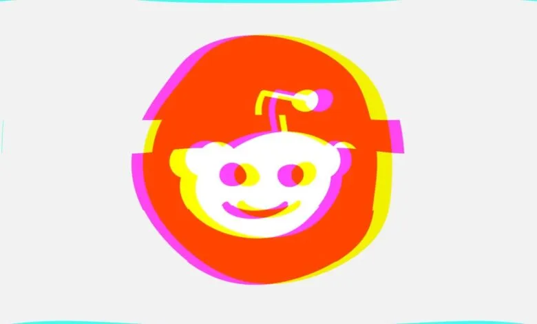 Glitch art of the Reddit alien logo with orange, yellow, and magenta layers.