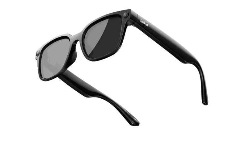 Black Rokid smart glasses with gray lenses on a white background.