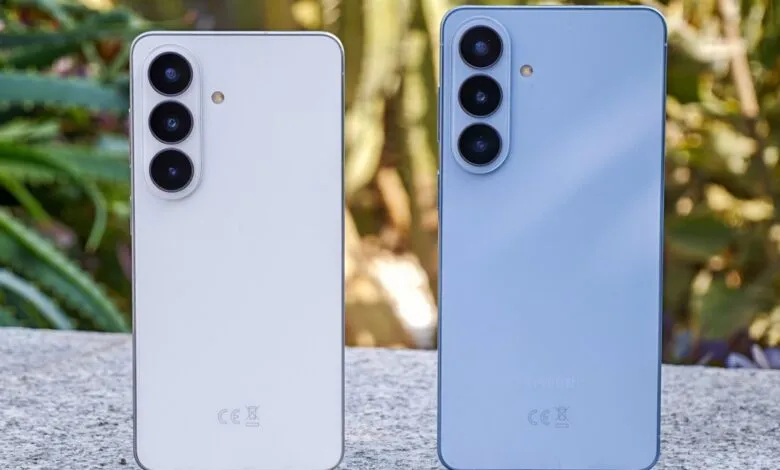 Two Samsung Galaxy S24 phones, white and light blue, back view.