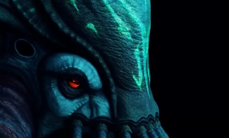 Close-up of a blue alien creature with a red eye against a black background.
