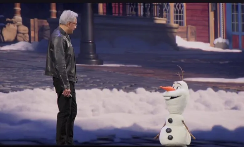 Jensen Huang stands next to Olaf from Frozen on a stage.
