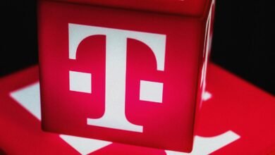 Close-up of T-Mobile logo on red cubes, white 'T' against vibrant red.