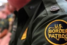 Close-up of U.S. Border Patrol uniform with patch and badge.