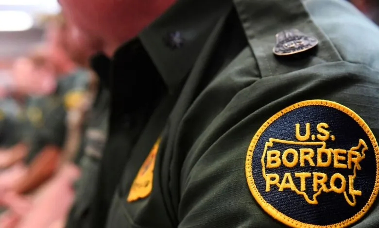 Close-up of U.S. Border Patrol uniform with patch and badge.