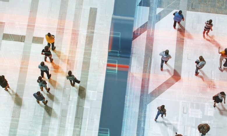 Overhead view of diverse people walking on a patterned floor.