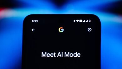 Close-up of a smartphone screen displaying 'Meet AI Mode' with Google logo.
