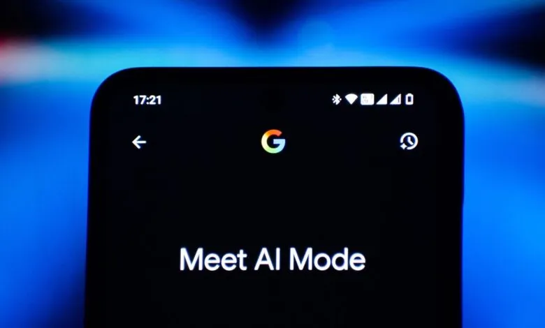 Close-up of a smartphone screen displaying 'Meet AI Mode' with Google logo.