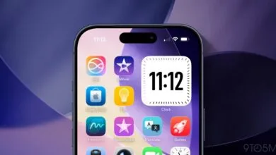 iPhone home screen showing app icons and clock widget at 11:12.