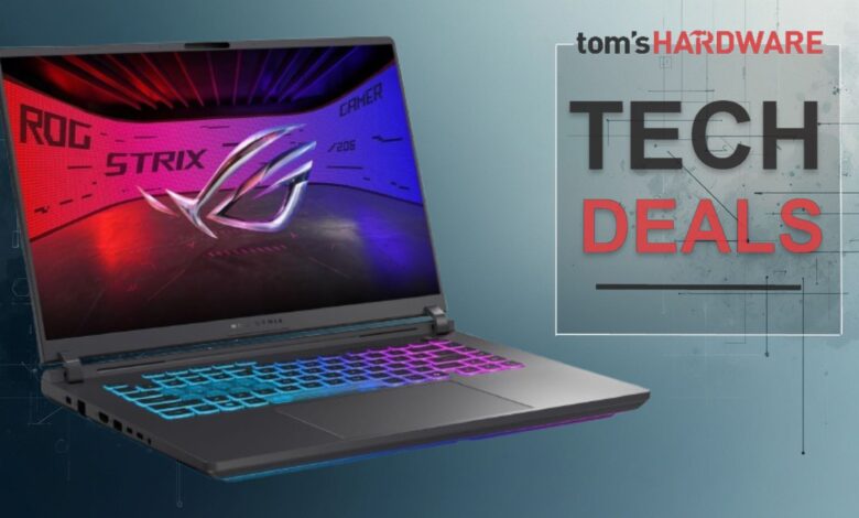 ROG Strix gaming laptop with colorful keyboard and screen display.