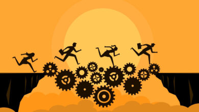 Silhouetted figures running across gears over a chasm, orange background.