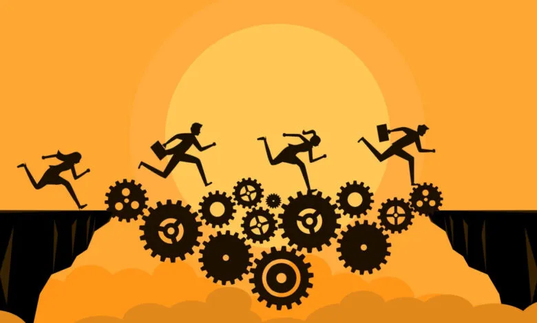Silhouetted figures running across gears over a chasm, orange background.