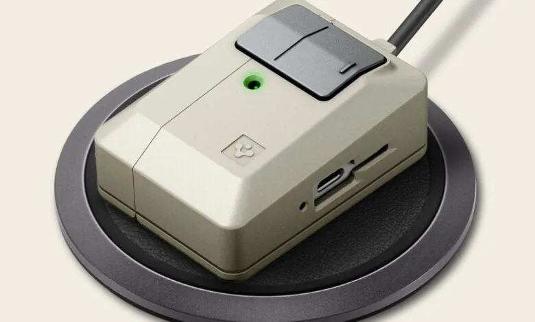 Retro-style beige device with gray accents on a wireless charging pad.