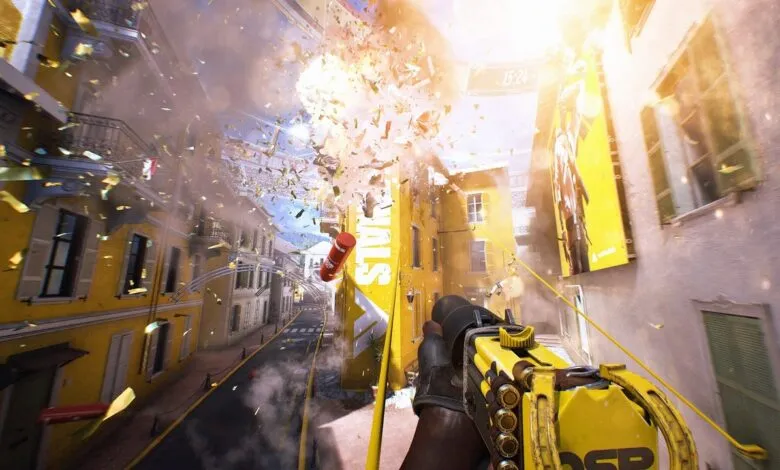First-person view of a street explosion with confetti and a yellow weapon.