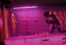 Figure in tactical gear kneels in room with hazmat suits and graffiti.