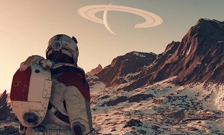 Astronaut in spacesuit gazes at ringed planet over snowy mountains.