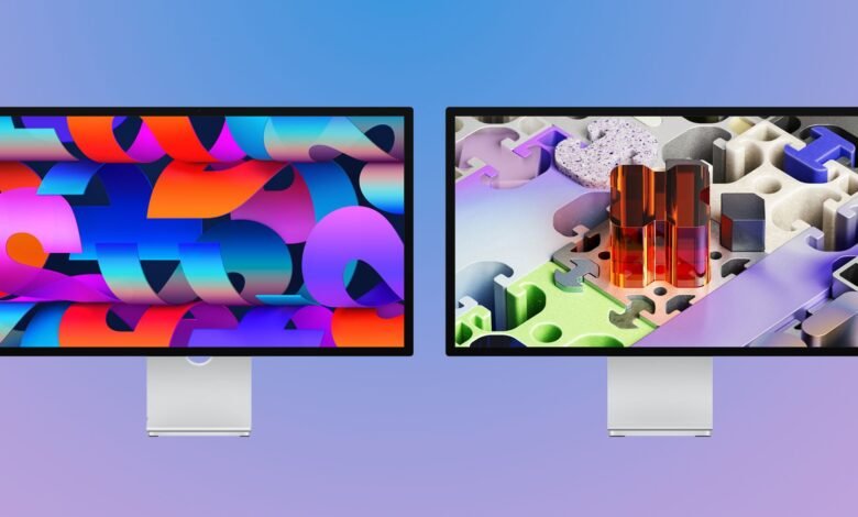 Two studio displays with colorful abstract wallpapers on a gradient background.