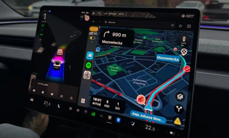 Tesla touchscreen displaying navigation map with route to Mazowiecka, Krakow.